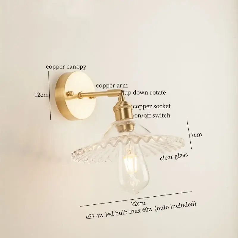 Vintage brass wall light with a green glass led ornate petal-shaped shade for bedroom decor
