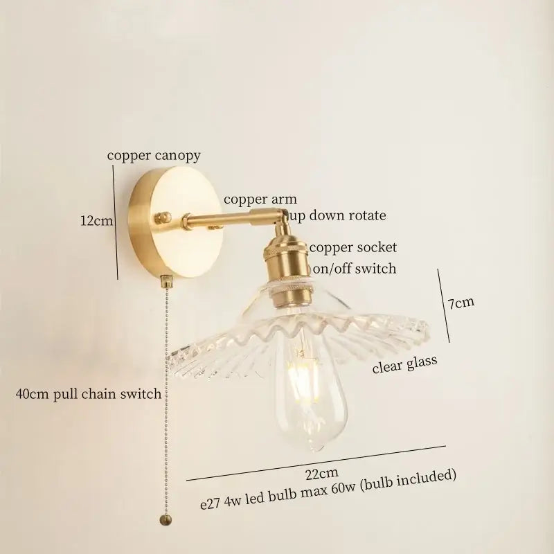 Vintage brass wall light with a green glass led clear fluted shade and exposed edison bulb for bedroom sconce use
