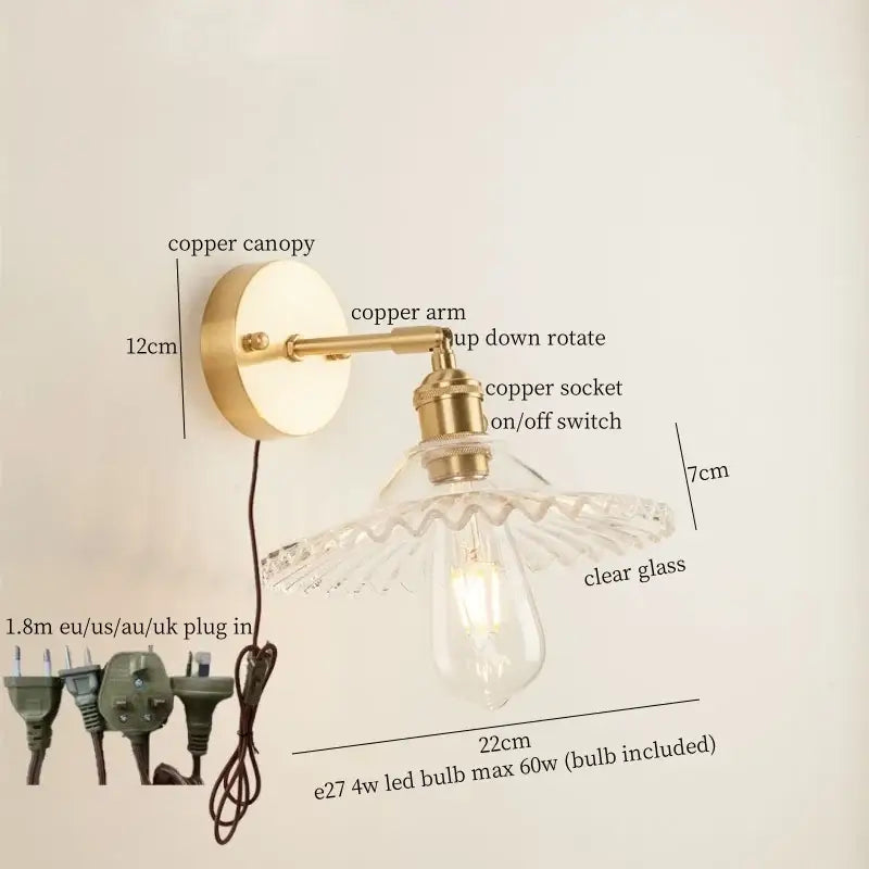 Vintage brass wall light with scalloped clear glass shade and green glass led accents for bedroom use