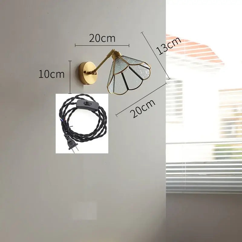 Vintage brass wall lights with green glass led shade featuring black metal framing and petal-like segments for bedroom