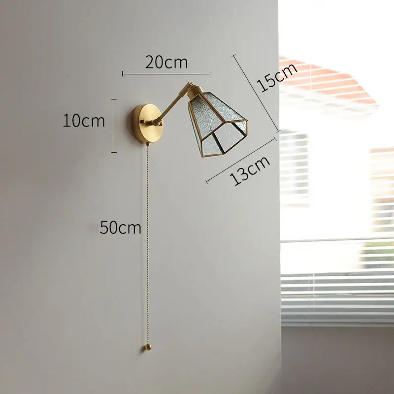 Gold-toned vintage brass wall lights with adjustable arm and geometric green glass led shade for bedroom sconce