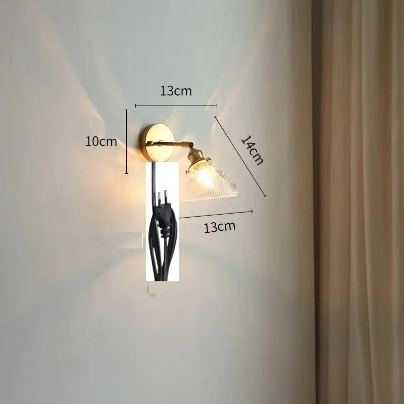 Vintage brass and green glass led wall lights featuring a clear textured glass shade for bedroom sconce lighting