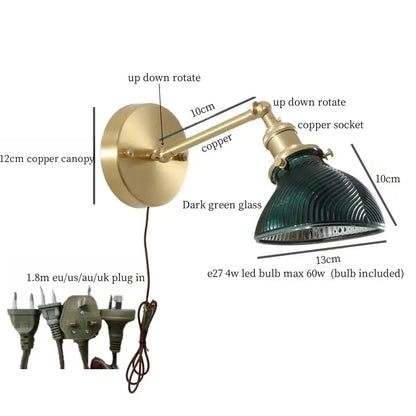 Vintage brass wall sconce with a green glass led ribbed shade and copper arm for bedroom lighting