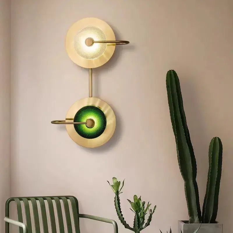 Modern vintage brass wall lamp with green glass metal wall art light featuring two circular glowing shades