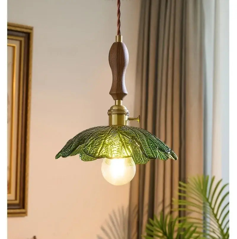 Vintage brass and green leaf led pendant lamp with dark wood handle and detailed glass shade for dining room lighting
