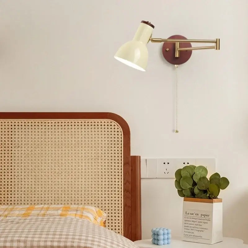 Cream-colored metal wall lamp with brass arm and dark brown base from decorbites creamy iron led collection