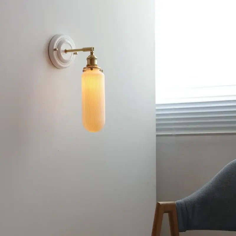 Vintage brass and amber ribbed glass led wall light with circular fixture for bedroom sconce lighting