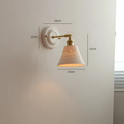White ceramic wall light with brass arm and decorative cloud motif shade for vintage led wall bedroom sconce