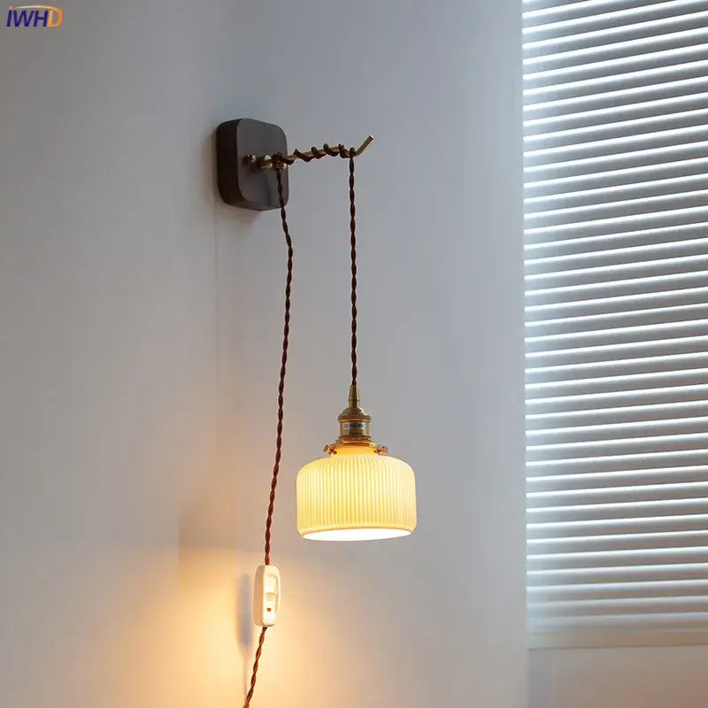 Vintage brass and ribbed glass led wall sconce with off-white shade and dark brown cord for bedroom decorbites led wall lighting