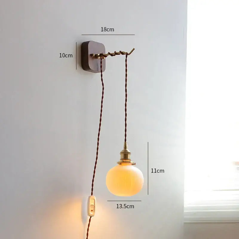 Vintage brass and ribbed glass led wall sconce with warm-toned frosted glass and twisted brown cord for bedroom decorbites led wall lighting