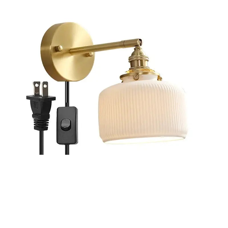 Gold-finished vintage brass led wall lamp with scalloped ribbed off-white glass shade for bedroom lighting