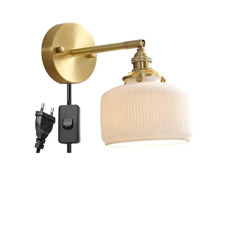 Vintage brass led wall lamp with gold-toned adjustable arm and scalloped off-white ribbed glass shade for bedroom