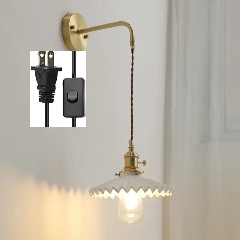 Vintage brass led wall lamp with scalloped white glass shade and twisted brown cord for bedroom lighting