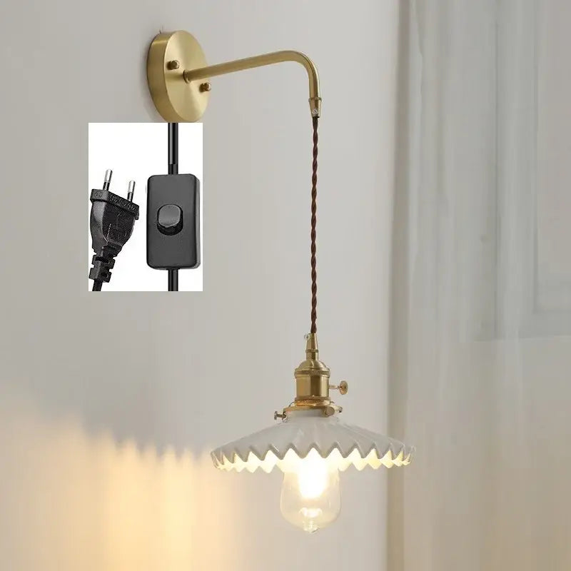 Vintage brass led wall lamp with scalloped white glass shade and twisted brown cord for bedroom lighting