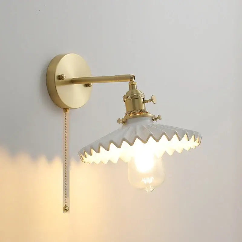 Vintage brass and scalloped glass led wall lamp with exposed bulb for bedroom lighting