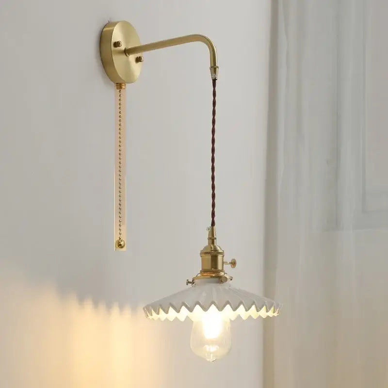 Vintage brass and scalloped glass led wall lamp with twisted brown cord for bedroom lighting