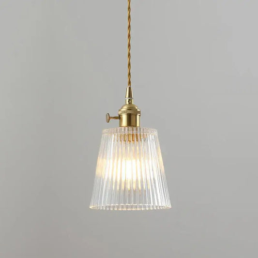 Vintage brass pendant light with striped glass shade and polished copper fixture for elegant dining room lighting