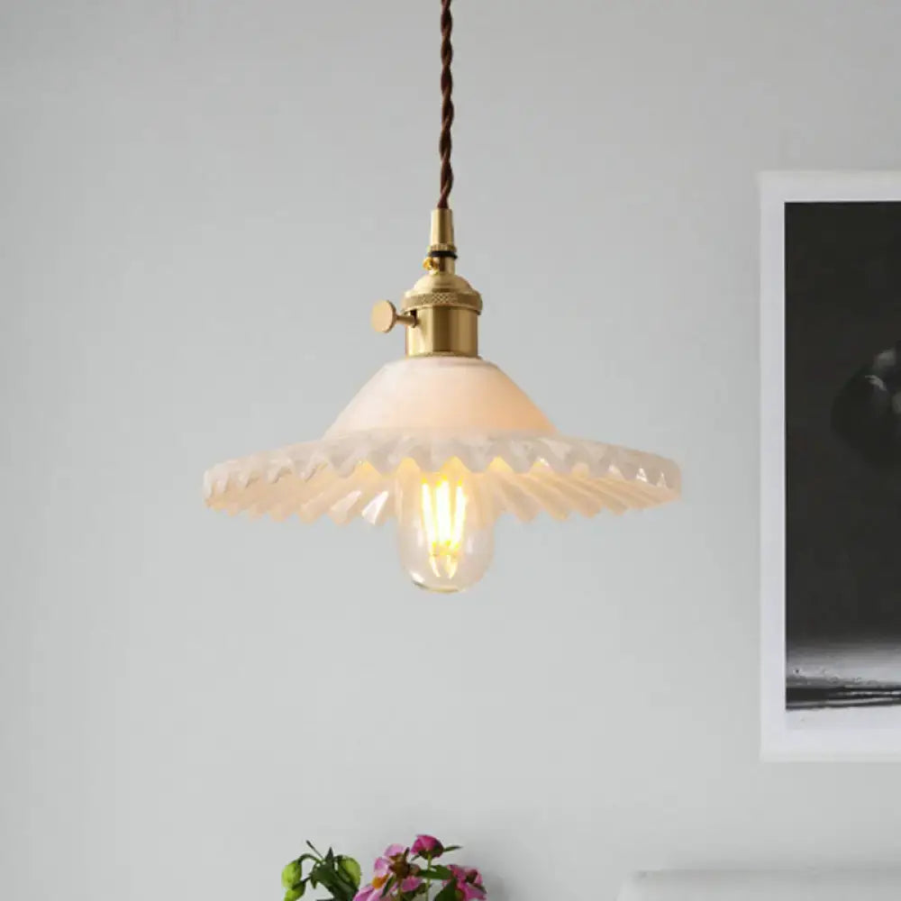 DecorBites™ Chloe scalloped pendant light with industrial brass fixture and white glass shade featuring edison bulb