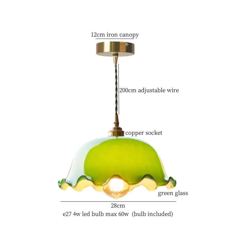 A charming green glass led pendant light with scalloped edge and vintage brass hardware for bedroom use