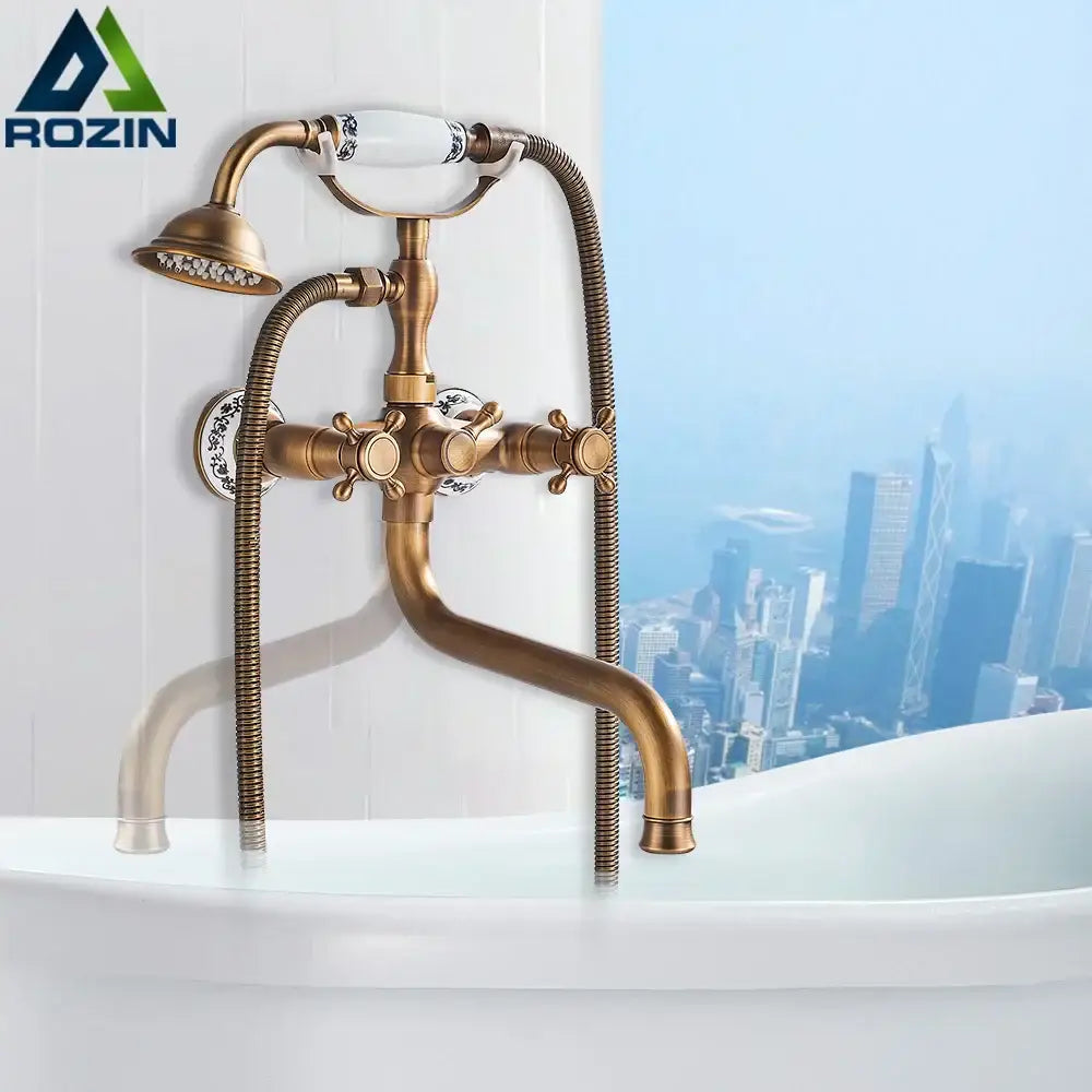 Vintage brass antique tub faucet with handshower set featuring brass finish ceramic handles and decorative spout