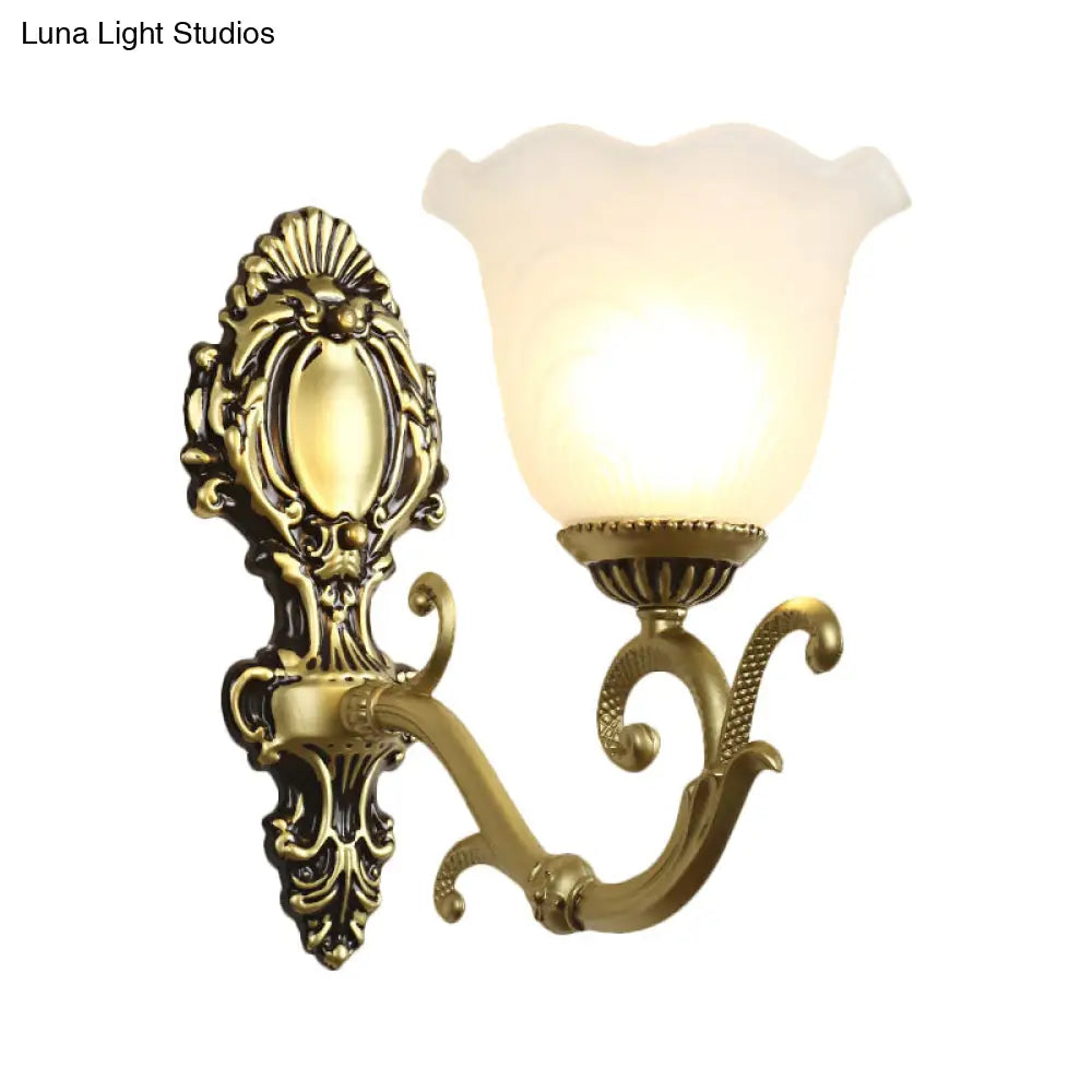 Vintage Brass/Beige Frosted Ribbed Glass Wall Sconce Lamp with Curvy Arm - 1 Light Bloom Sconce