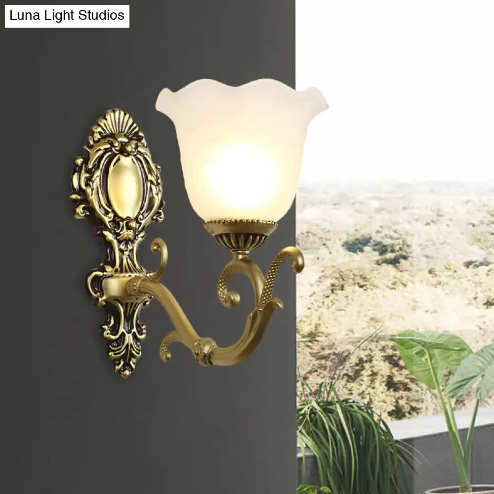 Vintage Brass/Beige Frosted Ribbed Glass Wall Sconce Lamp with Curvy Arm - 1 Light Bloom Sconce