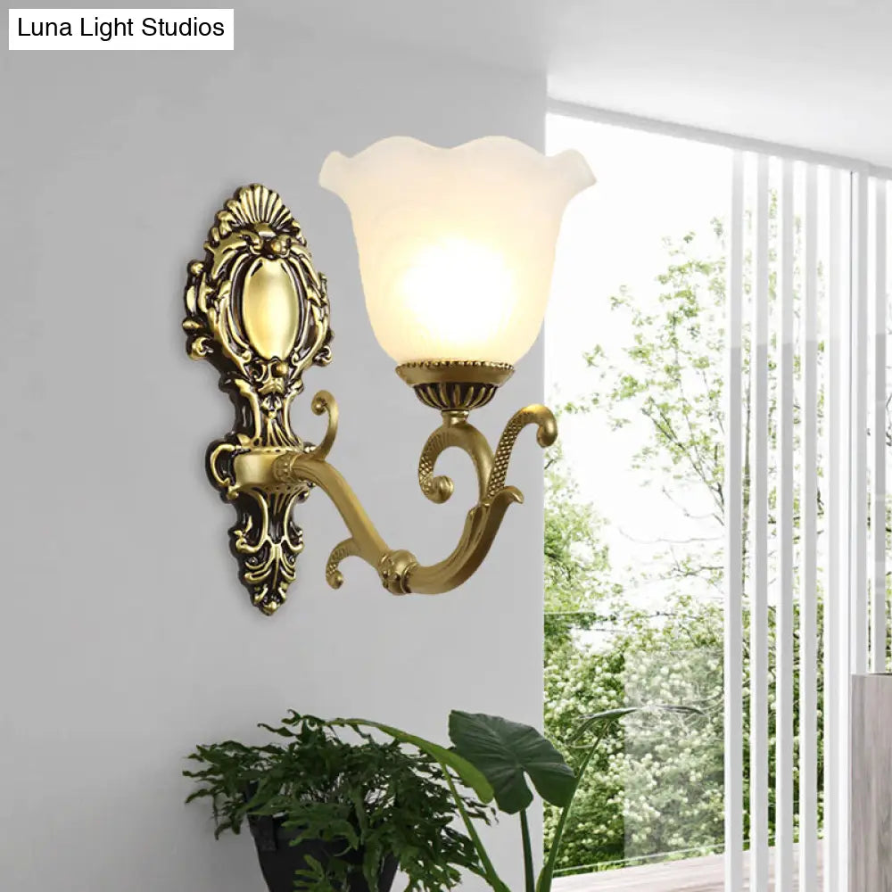 Vintage Brass/Beige Frosted Ribbed Glass Wall Sconce Lamp with Curvy Arm - 1 Light Bloom Sconce