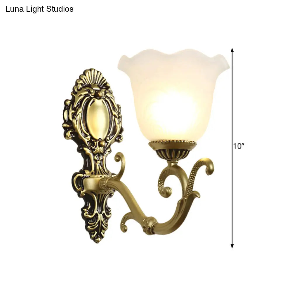 Vintage Brass/Beige Frosted Ribbed Glass Wall Sconce Lamp with Curvy Arm - 1 Light Bloom Sconce
