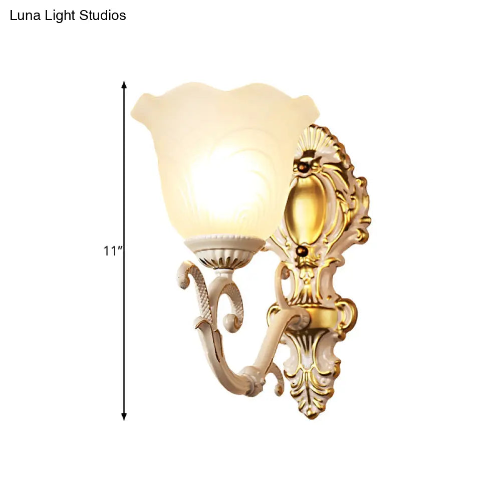 Vintage Brass/Beige Frosted Ribbed Glass Wall Sconce Lamp with Curvy Arm - 1 Light Bloom Sconce