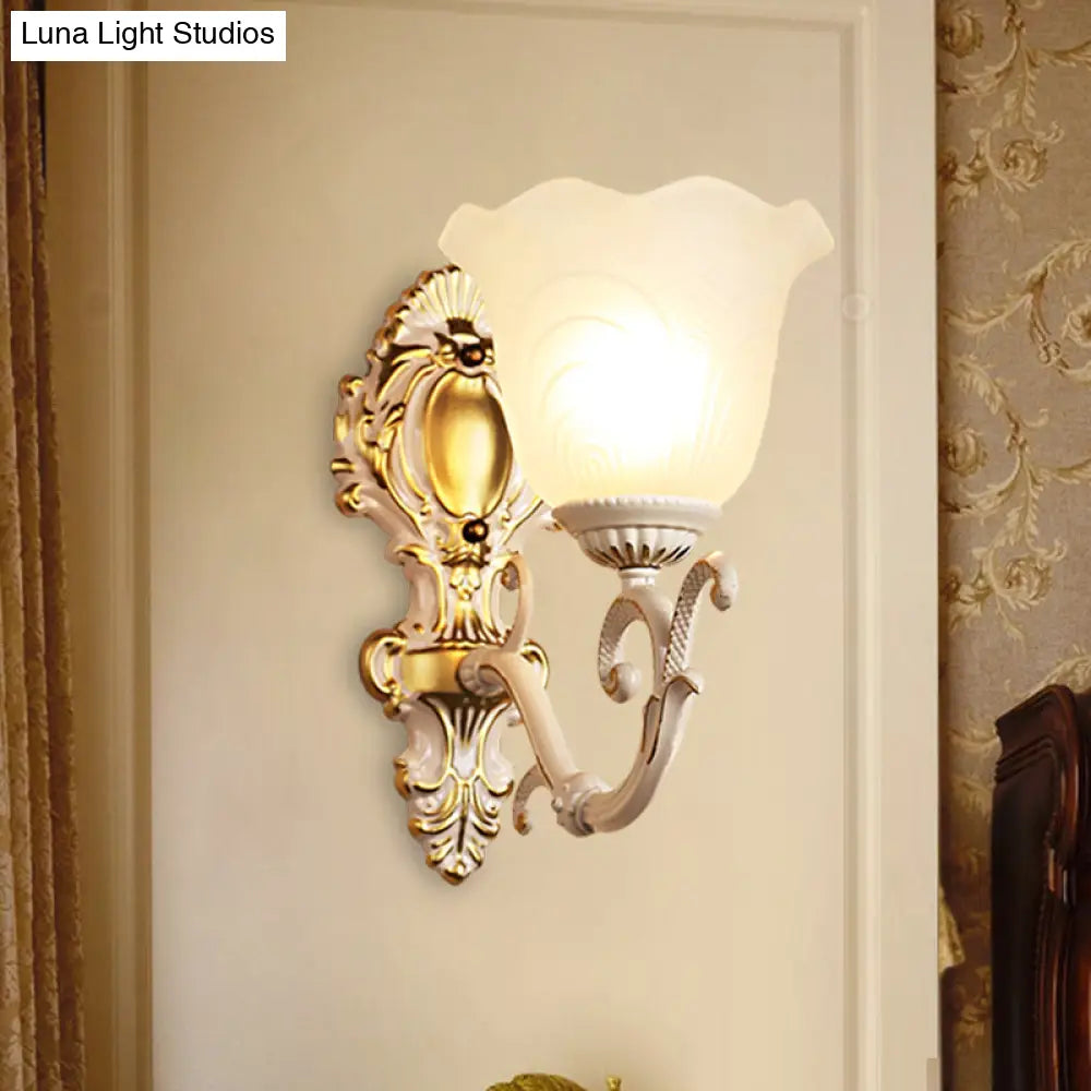 Vintage Brass/Beige Frosted Ribbed Glass Wall Sconce Lamp with Curvy Arm - 1 Light Bloom Sconce
