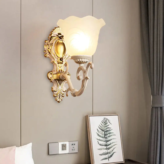 Vintage Brass/Beige Frosted Ribbed Glass Wall Sconce Lamp with Curvy Arm - 1 Light Bloom Sconce
