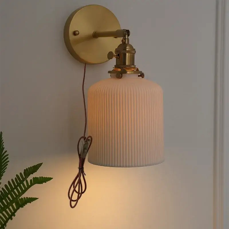 Brass-finished ceramic knob wall light with ribbed off-white glass shade and exposed wiring vintage wall lights for bedroom
