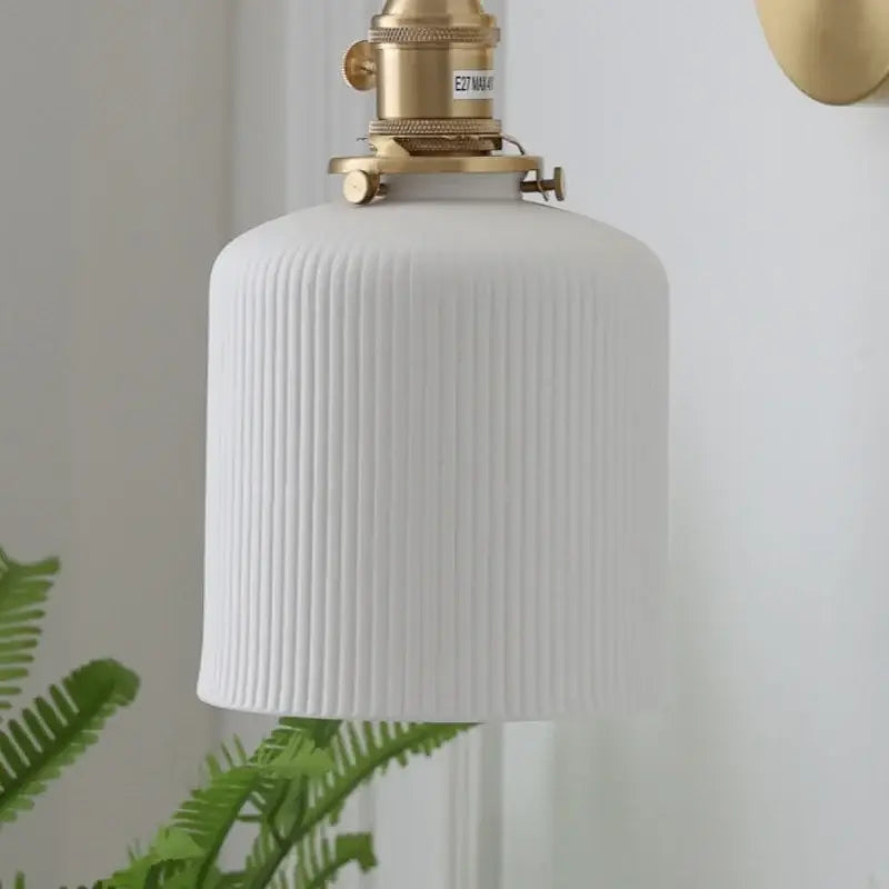 White ribbed ceramic knob wall light with brass-finished metal fixture vintage brass ceramic wall lights for bedroom