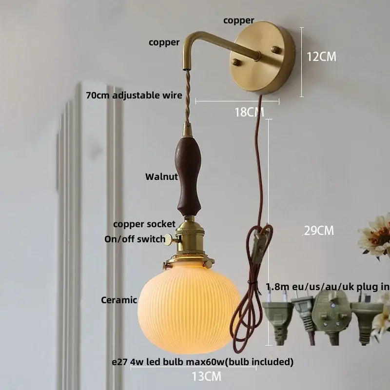 Vintage brass ceramic knob wall light with copper sconce, walnut handle, adjustable wire, and ribbed glass shade for bedroom
