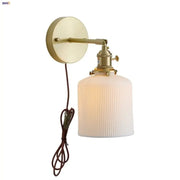 Vintage brass ceramic knob wall light with ribbed off-white glass sconce and adjustable arm for bedroom lighting