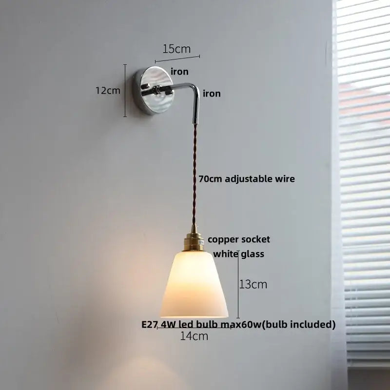 A vintage brass ceramic led wall lamp with a sleek iron bracket and adjustable white glass shade for decorbites ceramic led wall lighting