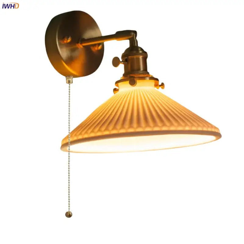 Vintage brass ceramic led wall lamp with ribbed warm-toned glass shade and adjustable pull chain switch by decorbites