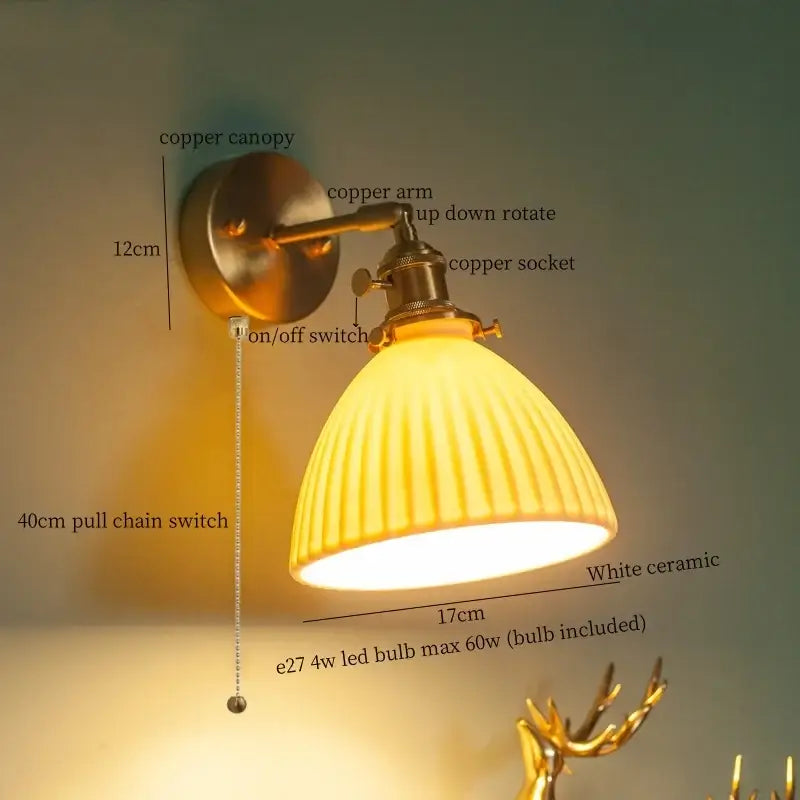 A warm yellow ribbed white ceramic wall lamp with copper-finished arm for bedroom decorbites brass ceramic led lighting