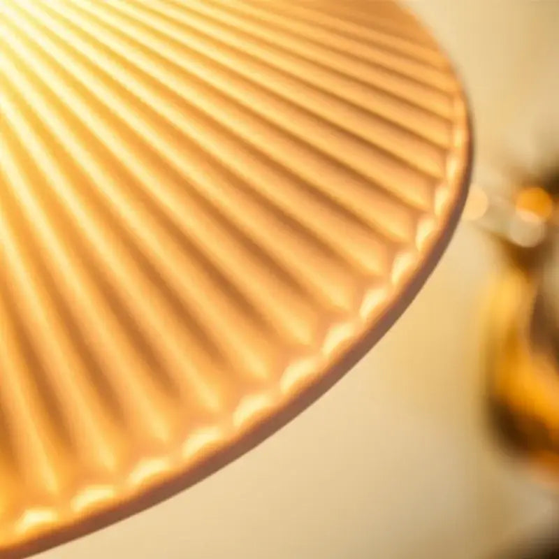Vintage brass ceramic led wall lamp with golden ribbed lampshade and warm glowing finish for bedroom decorbites brass ceramic