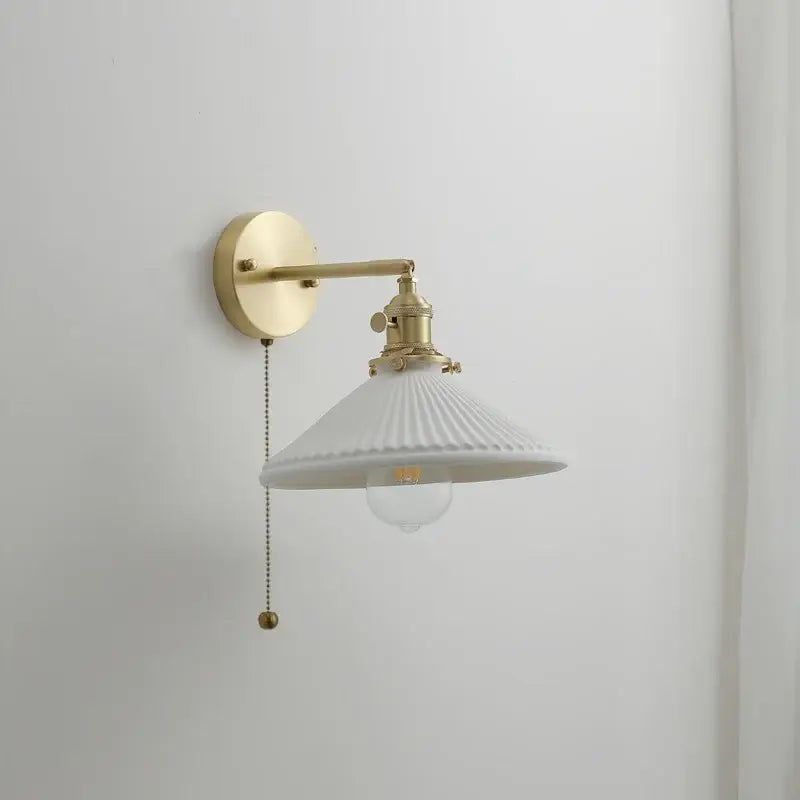 Vintage brass ceramic led wall light with ribbed glass shade and brass arm for elegant bedroom decorbites ceramic led wall light