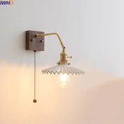 Vintage brass ceramic led wall sconce featuring a white scalloped glass shade and exposed bulb for bedroom decorbites ceramic led wall