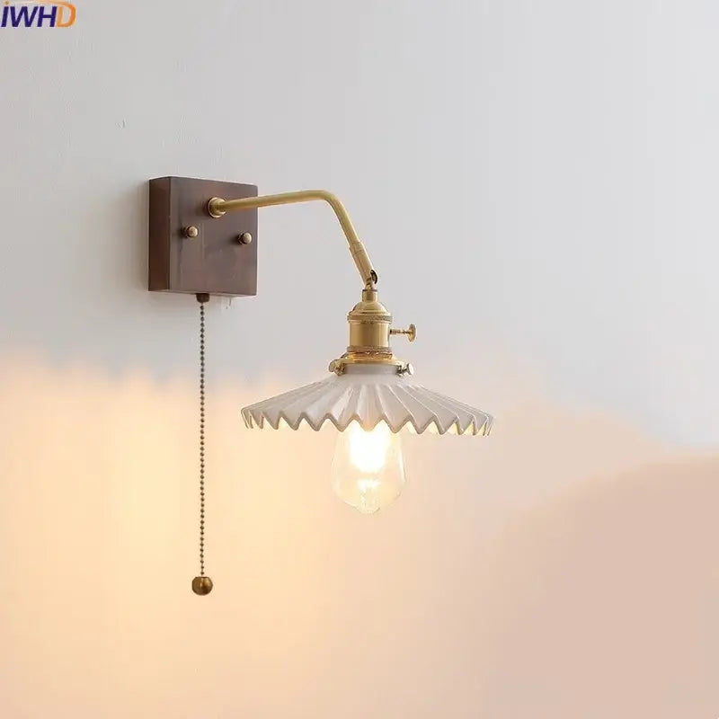 Vintage brass ceramic led wall sconce featuring a white scalloped glass shade and exposed bulb for bedroom decorbites ceramic led wall