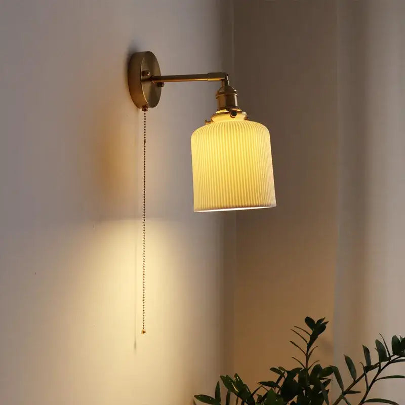 Vintage brass ceramic led wall sconce with ribbed cream glass shade and pull-chain switch for bedroom decorbites ceramic led wall