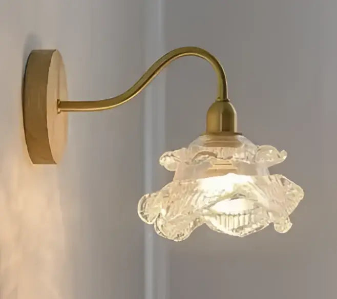 Vintage brass ceramic wall lamp with knob switch featuring a delicate carved glass shade shaped like an open flower for decorbites ceramic wall use