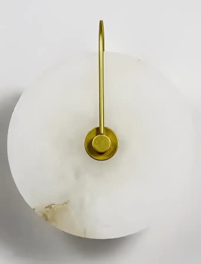 A sleek white marble wall lamp with polished brass base and knob switch decorbites ceramic wall sconce for bedroom