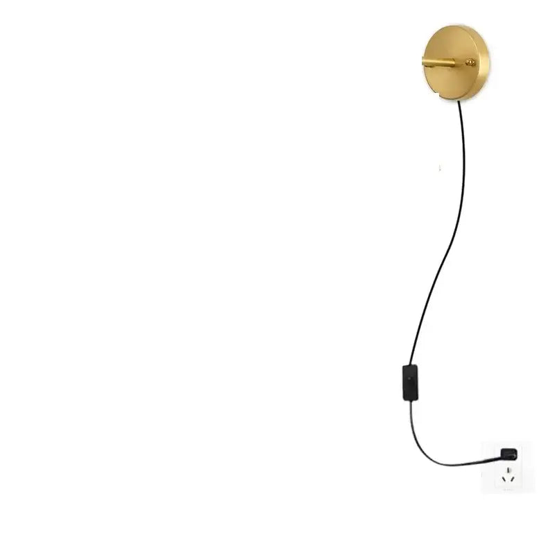 Gold-colored circular vintage brass chevron clear glass led wall lamp with minimalist design and black cord outlet connection
