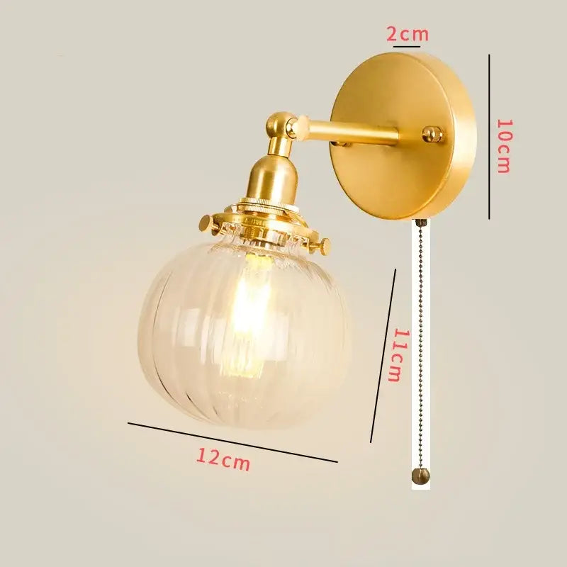 Vintage brass chevron wall lamp with clear ribbed glass globe and exposed led filament bulb bedroom sconce