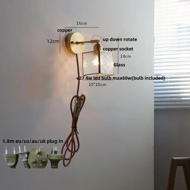 Copper wall lamp with clear glass square shade, adjustable arm, and pull chain switch for bathroom use