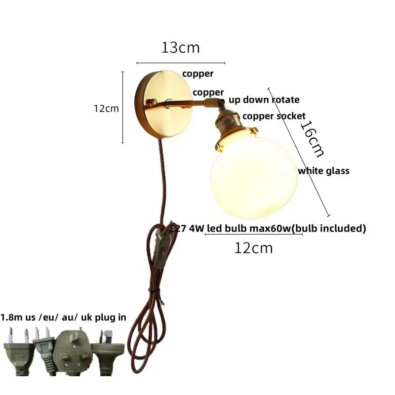 Vintage brass wall lamp with clear glass globe, copper adjustable arm, and pull chain switch for bathroom use