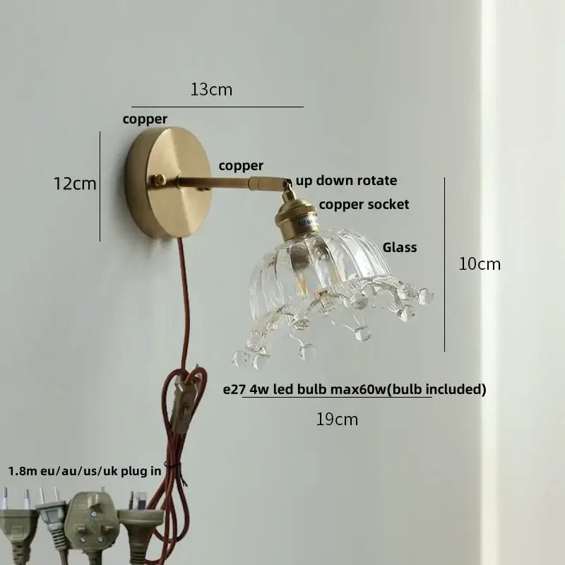 Vintage brass wall lamp with clear glass shade, dangling crystal droplets, and pull chain switch for bathroom use